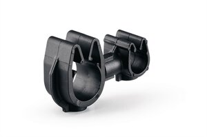 A rotatable dual routing clip that keeps two routings secured and separated.