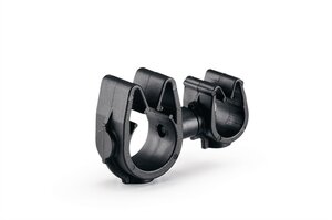 A rotatable dual routing clip that keeps two routings secured and separated.