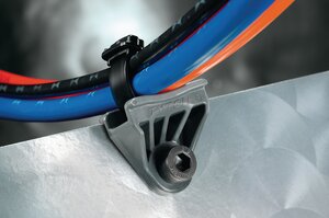 Axial oval mounts stand off bundles from frame rails and cross members to prevent them from rubbing and chafing.